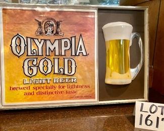 Lot 1617. Asking $75.00. Vintage Olympia Gold Light Beer Sign. Lights Up Great! 20.5" W x 13.5 H x 4" D. Perfect addition to your bar or Man Cave!