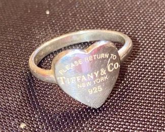 Lot 1608. $125.00. Tiffany & Co, Sterling Silver Heart Ring Size 6 - Heart says, Please Return to Tiffany and Co., New York 925"
