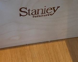 Lot 1641. Asking $750.00 Stanley Furniture Maple Queen Bed with Headboard and Footboard and Mattress/Box Spring. Includes the two side night tables (Tops of nightstands are in Rough Shape). 80" W. There are a number of accompanying pieces to this bed - the Homeowners paid $5,255 for the bed, 2 nightstands, 1 long dresser with mirror, 1 tall 12-drawer dresser and the desk.