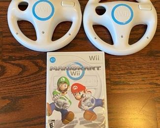 Lot 1646. $100.00 "The Wii Bundle": Wii Game Console, 2 Remote Controller, 2 Nunchucks, Mario Kart with 2 Wheels and Game, Wii Sports, Resort Sports Games and 2 Extra Battery Packs plus Nyko Battery Charger. $100.00"