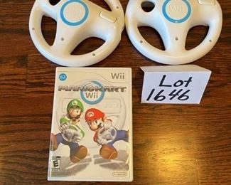 Lot 1646. $100.00 "The Wii Bundle": Wii Game Console, 2 Remote Controller, 2 Nunchucks, Mario Kart with 2 Wheels and Game, Wii Sports, Resort Sports Games and 2 Extra Battery Packs plus Nyko Battery Charger. $100.00"
