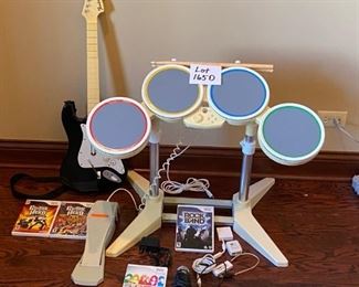 Lot 1650. $100.00. Wii Rock Band Drum Set and Game, Rock Band Microphone with Wii Sing Game, Rock Band Guitar with 3 Guitar Hero Games. Nice Lot!