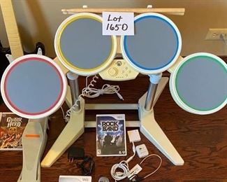 Lot 1650. $100.00. Wii Rock Band Drum Set and Game, Rock Band Microphone with Wii Sing Game, Rock Band Guitar with 3 Guitar Hero Games. Nice Lot!