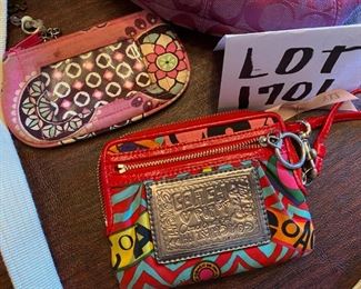 Lot 1701. $45. One Coach handbag, Vera Bradley and Coach coin purses (or wristlets).