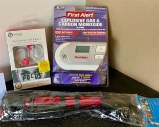 Lot 1712. $20.00 First Alert CO2 Gas and CO2 Alarm, Bike Pump and Ear Buds