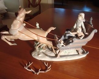 Dining Room Table:  A large beautiful LLADRO titled "Winter Wonderland" (Serial #1429; Retired) is displayed on the dining table so you can see all sides of it.  The reindeer horns are detached and will be with the cashier. An associate will assist you with it but it is not to be handled or removed until purchased.