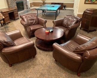 4 matching leather arm chairs with round table 