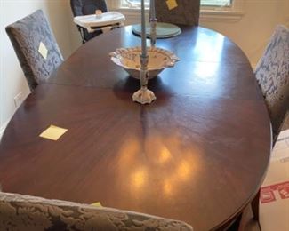 Dark brown, oval dining table with Crate and Barrel chairs