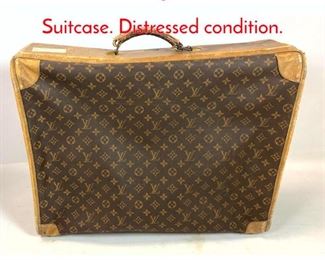 Lot 1392 Vintage Louis Vuitton Suitcase. Distressed condition.