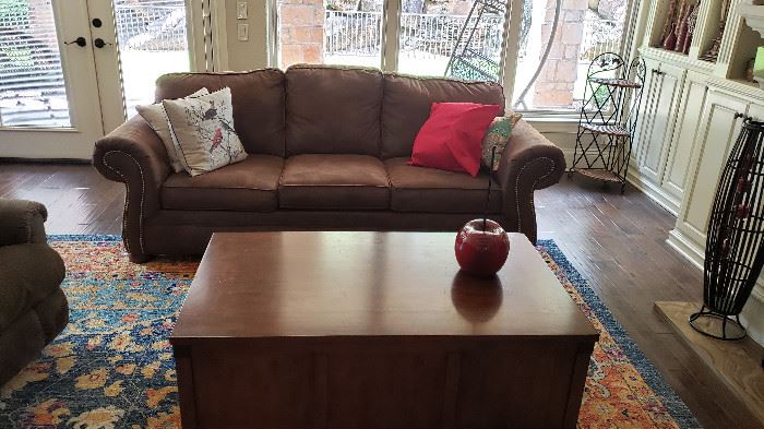 sofa, pillows, coffee table on rollers, decor, rug
