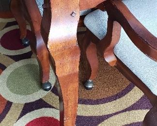 legs on kitchen table and chairs, up close of rug