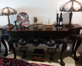 Massive carved side table, Tiffany style lamps, decor