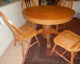 Oak Pedestal table, claw foot, four side chairs