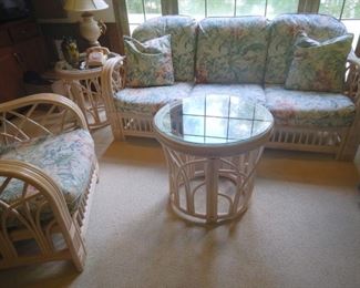 Benchcraft rattan three cushion sofa, club chair, 2 end tables with glass tops and round glass top cocktail center table