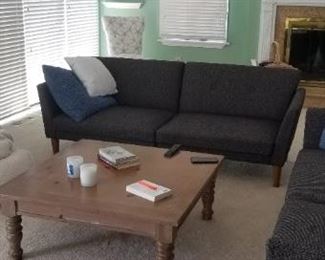 Couch converts to a futon, sleeps two!