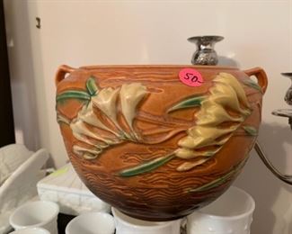 #84	Coral Roseville Pot w/lillies on front  669-6	 $50.00 

