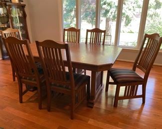 Very nice Mission Style Walter of Wabash dining table with Richardson Bros. chairs.  This 44” wide table expands from 68” to 112” with the four 11” self storing table leaves.  