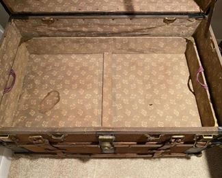 Antique steamer trunk brought over from Norway around 1900 with original leather straps and insides