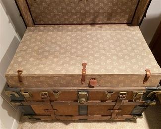Antique steamer trunk brought over from Norway around 1900 with original leather straps and insides