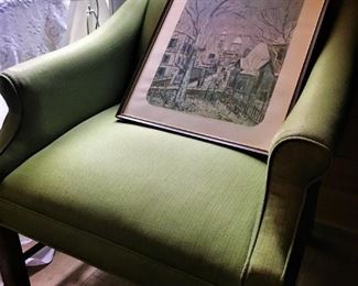 Green upholstered arm chair, framed art