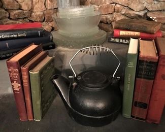 Vintage cast iron tea kettle, glass dishes, vintage and antique books
