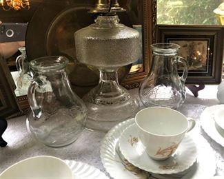 Etched glass pitchers, glass oil lamp, more