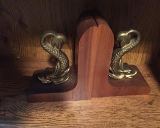 Wooden Book ends with brass serpents.