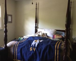 Four Poster Bed and Navy Blanket.