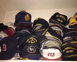 Over 100 Baseball Caps from various places and with different insignias.