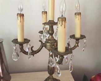 Matching electric brass candlestick lamps.