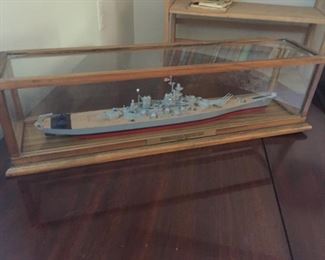 Wooden ship model in glass case.