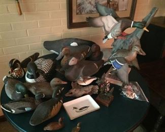Carved and ceramic duck decoys.