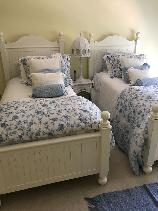 Twin beds , complete with bedding