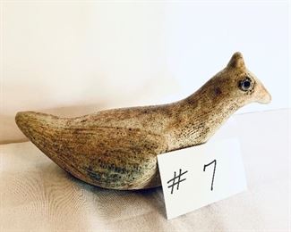 UNSIGNED POTTERY BIRD 
9.5”L.      $95