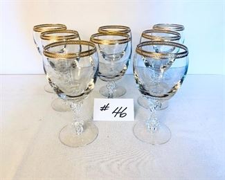 Eight gold rimmed water goblets $80