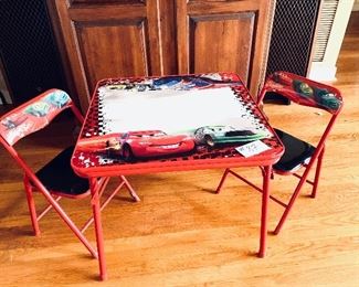 “CARS” 
Children’s table and two chairs 20 inches tall $25
