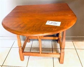 Dropleaf side table
 see photo for wear
 32 inches wide by 23 inches tall $99