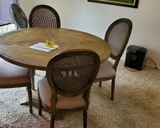 Lot #38 - $250 Kitchen Table & 4 Chairs. Overall good condition, a couple of the chair backs have small holes in them.