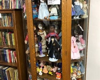 Antique Oak Cabinet and Various Dolls