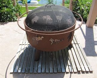 Wildlife cut outs fire pit with wood slat base