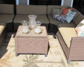 Enjoy your days outside with this rattan patio set and table.  Multiple arrangements -  Cushions as is. 9'6" x 6'8"  coffee table included 27"x27" 