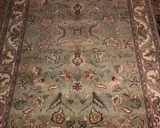 Wool rug  approximately 5x8  Pale aqua blues, greens, deep reds, ivory colors. $165