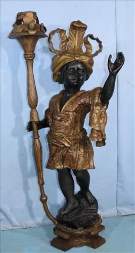 025a Bronze cast blackamoor holding torch, stands 55 in. T, 17 in. W.