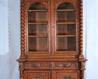 047a Oak heavily carved English bookcase with fish and birds carved on doors, 8 ft. 5 in. T, 52 in. W, 23.5 in. D.