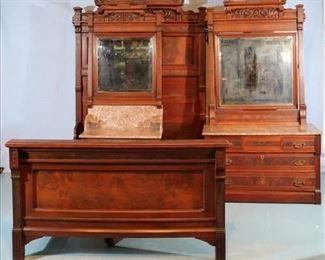 054a 3 piece walnut Victorian bedroom suit with carved crown, brown marble and original brass pulls, 83 in. T, 56 in. W, 74 in. L.