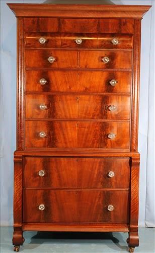 078a Large mahogany Empire Chest on Chest with flamed mahogany front, 10 drawers, scroll feet and glass pulls, 7 ft. 5 in. T, 46 in. W, 26 in. D.