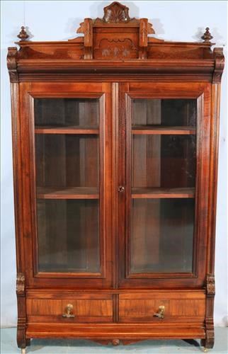 094a Walnut Victorian bookcase with 2 doors and 2 drawers, 75 in. T, 41.5 in. W, 15 in. D.