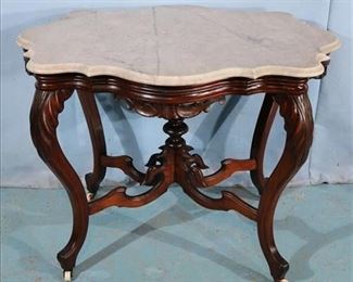 170a Walnut Victorian turtle top parlor table with white marble and carved knee legs, 29 in. T, 36 in. L, 28 in. D.
