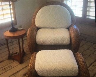 Beautiful custom Ratan chaise chair with creme cushions. Vintage table and lamp. 