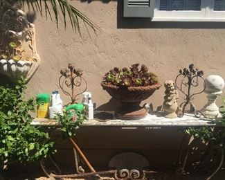 Large and gorgeous outdoor table, more outdoor wall and ground decor & artistic potted succulents.
